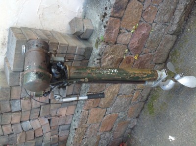 the remains of the stenciling can still be seen on the exhaust tube and a small portion of the tank.